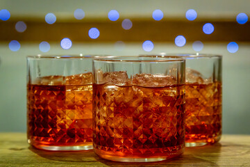 Three cocktails on a table, with a shallow depth of field