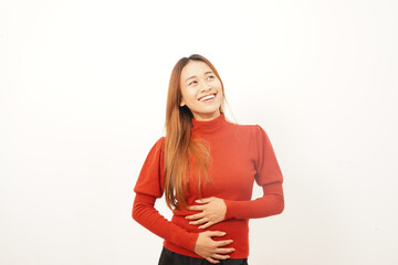 Young woman laughing and holding her stomach, looking upwards, expressing great joy, humor, or deep amusement