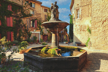 Beautiful fountain at the pretty little Lacoste village in Provence town, France