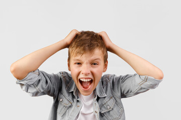 Exaggerated Portrait of Boy Cheering or Yelling with Hands on Head