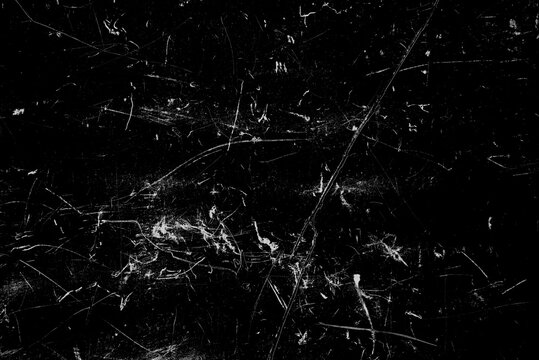 Dark grunge texture overlay with scratches, scuffs, and distressed marks on black background. Ideal for aging effects, vintage photo overlays, worn film looks, and gritty design compositions.