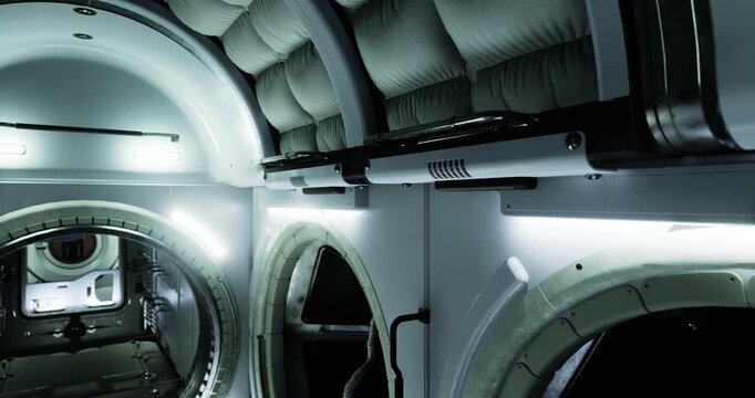 The interior features sleek design with padded walls, ambient lighting, and a spacious layout. It showcases advanced technology for human habitation in space.