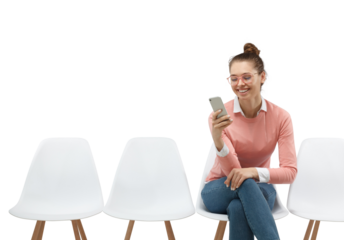 Woman wearing eyeglasses and casual pink sweater sitting in the line, holding phone and texting
