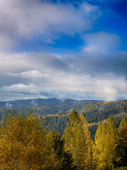 Sunny Autumn Carpathians with Puffy White Clouds