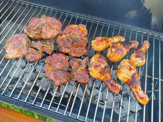 Delicious grilled meat on outdoor barbecue grill