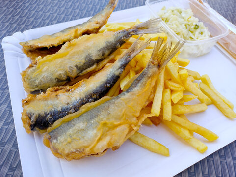 Delicious fried fish and chips with coleslaw