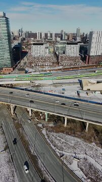 Aerial Drone View of Don River and Keating Channel with Gardiner Bridge, GO Train, and Distillery Loop
