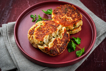 Kaspressknödel - traditional Austrian fried cheese bread dumplings served as close-up on a design plate