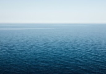 Obraz premium An endless expanse of deep blue ocean water meeting the horizon under a pale sky, symbolizing infinity and tranquility, freedom, tranquil, horizon
