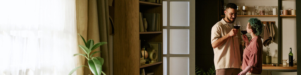 Website banner of man and woman standing in modern kitchen clinking wine glasses, smiling and making eye contact, enjoying casual moment together