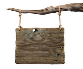 Wooden sign hanging from a branch with rope. Wooden signboard has a rough texture and unfinished surface.  
