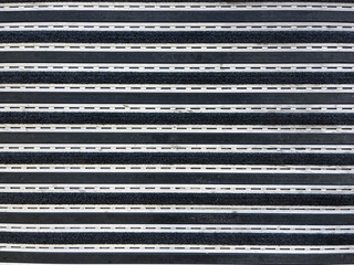 Carpet texture with grids at the school entrance