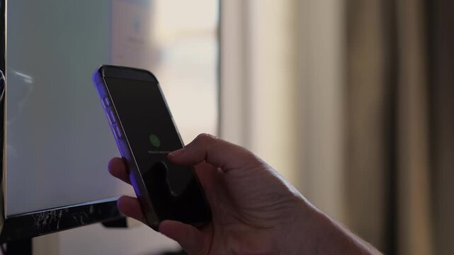 Middle Aged Man Working From Home Remotely is Prompted for Multi Factor Authentication Approval While Signing In Work Computer Cybersecurity Concept