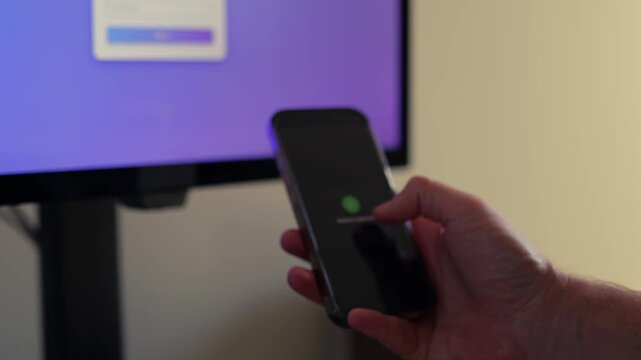 Middle Aged Man Working From Home Remotely is Prompted for Multi Factor Authentication Approval While Signing In Work Computer Cybersecurity Concept