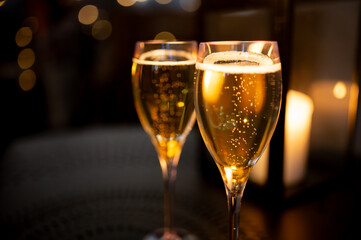 Two glasses of french sparkling wine champagne with little bubbles, New Year celebration, wedding...