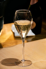 Glass of french sparkling wine champagne, cava, tasting of wine, bar, celebration, wedding or champagne tour with visit of caves, Reims, France