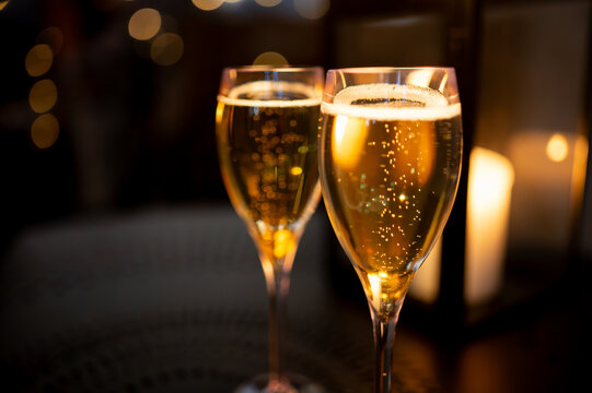 Two glasses of french sparkling wine champagne with little bubbles, New Year celebration, wedding or champagne tour with visit of caves, Reims, France