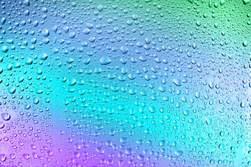 Glass surface with water drops, closeup view