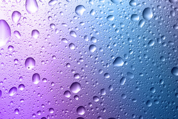 Glass surface with water drops, closeup view