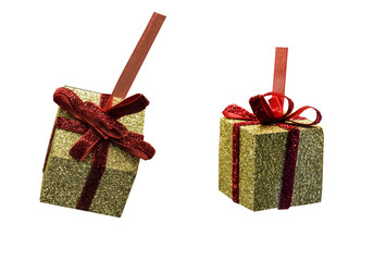 Two New Years gifts in gold wrapping and a red bow isolated