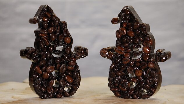 Two snowmen created from roasted coffee beans on a light background. Creative winter food art concept combining coffee aroma with festive mood, ideal for seasonal marketing, caf&eacute; branding, and holiday