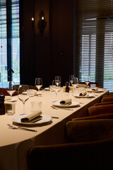 celebration setup ready, group gathering featuring meticulous table decor and lighting effects