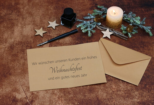 Weihnachtskarte: Brief mit Tintenfass, F&uuml;llfederhalter und Weihnachtsgr&uuml;&szlig;e. Wir w&uuml;nschen unseren Kunden ein frohes Weihnachtsfest und ein gl&uuml;ckliches neues Jahr.
