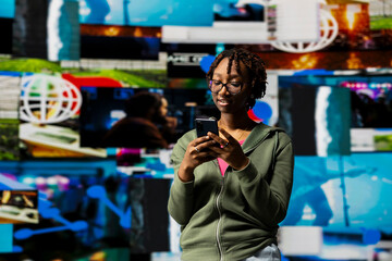 Person watches multimedia collage of modern social media networks videos on smartphone. African...