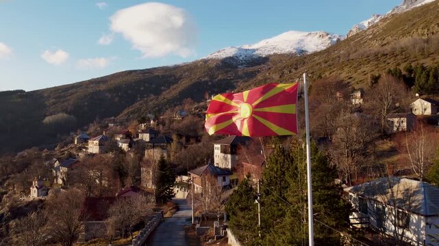 Macedonian Flag Waving Over Galichnik Village: A Picturesque Mountain Escape in the Balkans