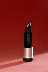 red lipstick on a black 