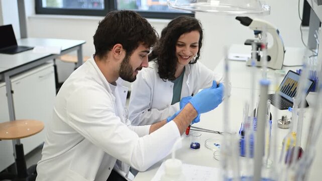 Two scientists collaborating on research in a modern laboratory