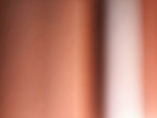 Warm abstract background with soft gradient light and texture.