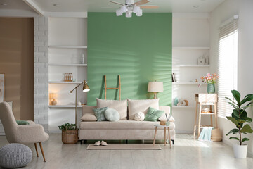 Living room with comfortable sofa and decor. Interior design