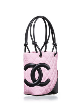 Chanel bag, Cambon model, in pink and black lambskin photographed on a white background with reflection. Milan, Italy, October 3_2025