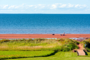 Crimson-colored sand beach of Northumberland strait near Chelton, Prince Edward island (PEI), Canada