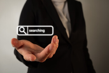 A businessperson extends their hand with the word 