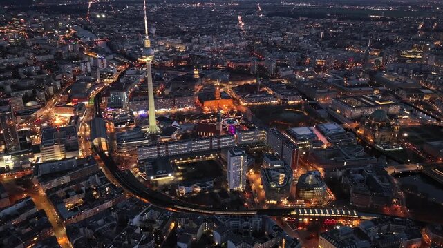 Christmas market in Berlin, Germany, Alexanderplatz at Winter Night, Aerial. Illuminated Weihnachtsmarkt in Berlin-mitte
