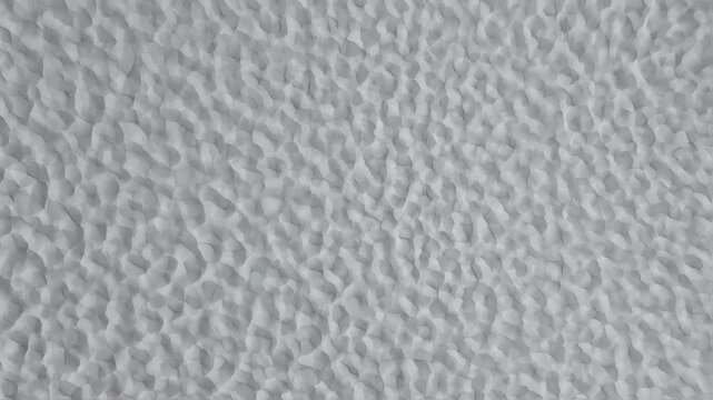 Abstract seamless gray textured background with subtle shadow effects