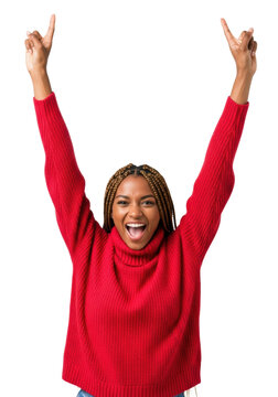 Young african american woman with long box braids in a vibrant red sweater, shouting in elation, arms raised in a v-pose against a transparent background. Concept of personal victory and success
