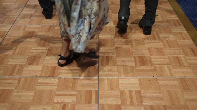 Guests March Across Wooden Floor, Close View Of Dancing Guests Feet, Guests Walking On Wooden Dance Area During Celebration