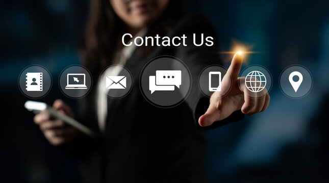 A professional businesswoman engaging with digital contact icons, emphasizing modern communication methods in a sleek office environment. Gantry - Powered by Adobe
