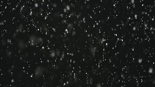 Realistic heavy snowfall overlay effect against a dark night sky creating a winter atmosphere for video production