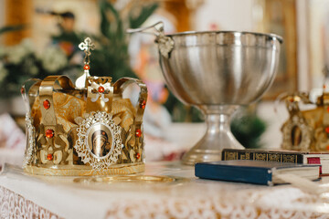 Crown and baptismal font preparing for church ceremony