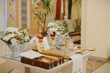 Orthodox church baptism table displaying religious objects