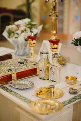 Orthodox baptism ceremony table with religious church items