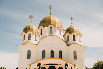 Orthodox church building with golden domes and crosses