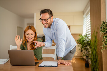 Coworkers collaborating on a video call working remotely