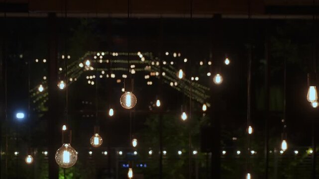 Twinkling String Lights Reflected On Glass Rows Of Bulbs Create Bokeh Arch Over Wet Street, Photographer Captures Festive Reflections, Cozy