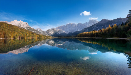 Majestic Mountains With A Crystal Clear Lake Reflecting Their Peaks