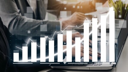 Focused professional analyzes financial data on a laptop, showcasing growth with charts and graphs in a modern office environment, emphasizing business strategy. Copula